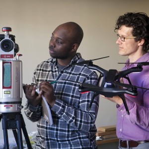 Civil engineering major Munyaradzi Chifetete '17 and Prof. Michael McGuire work with a LIDAR unit for 3D mapping.