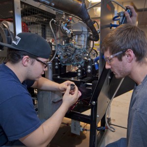 Mechanical engineering majors Matt Sosa ’16 and Andrew Burchenal ’16 work on the formula one race car.