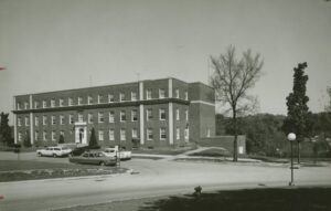 1952 photo of brick building with many windows known as Alumni Hall of Engineering